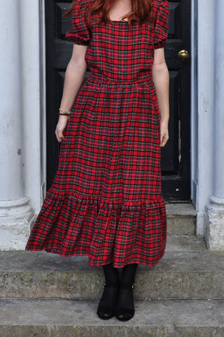 women wearing red tartan skirt