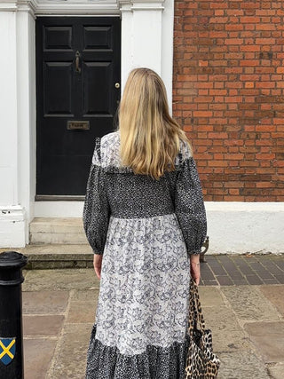 women wearing sustainable black and white dress