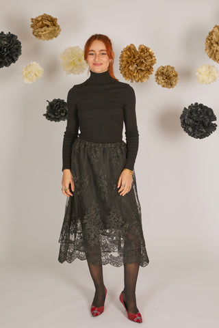 women wearing black lace skirt