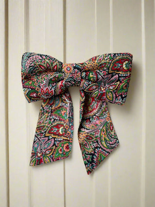 colourful paisley bow on table