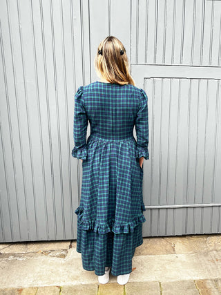 back women wearing tartan dress