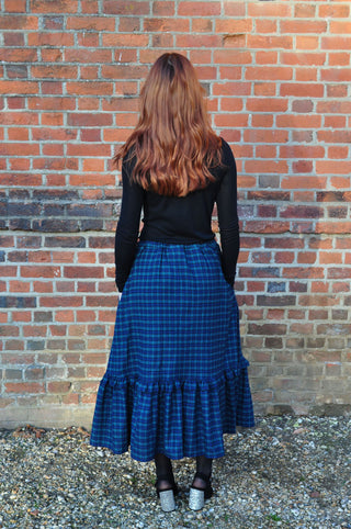 back view women wearing check skirt