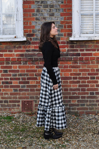 woman wearing gingham skirt side