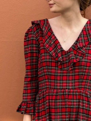 women wearing red tartan dress neckline detail