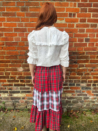 back women wearing mixed tartan skirt