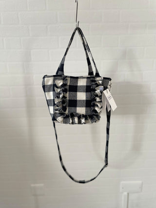 gingham tote hanging by wall with ruffle