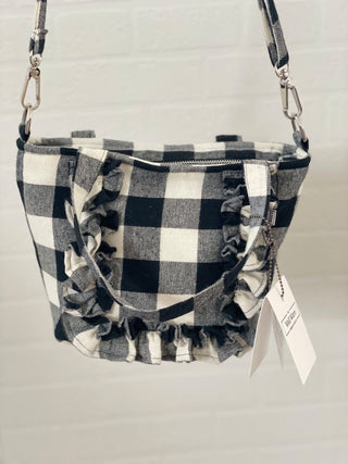 gingham tote hanging by wall