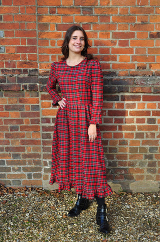 women wearing red check dress