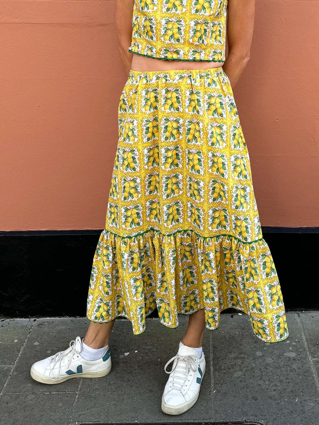 The Well Worn model in lemon tile print skirt