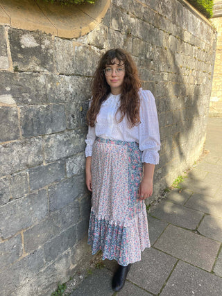 women wearing mixed print skirt