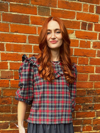 women wearing tartan rufled top