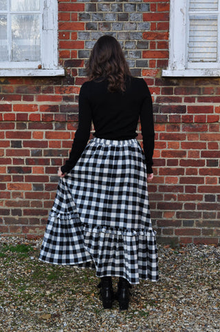 woman wearing gingham skirt with ruffle