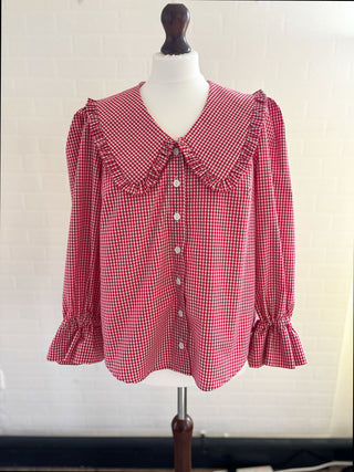 red gingham blouse on mannequin