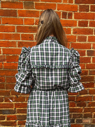 women wearing green tartan blouse