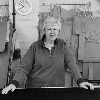 lady stood at cutting table