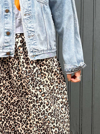 model wearing leopard skirt detail