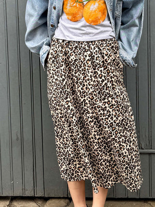 model wearing leopard skirt detail