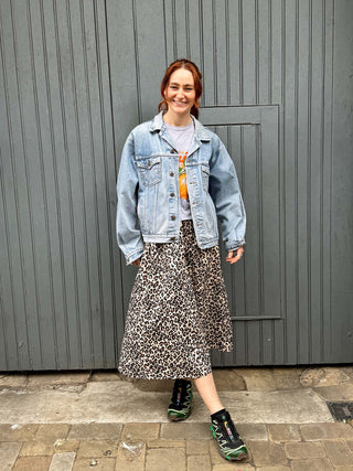 model wearing leopard midi skirt