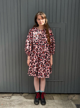 women wearing pink leopard dress