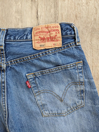 patched upcycled levi jeans on floor