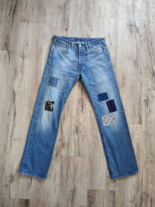 patched upcycled levi jeans on floor