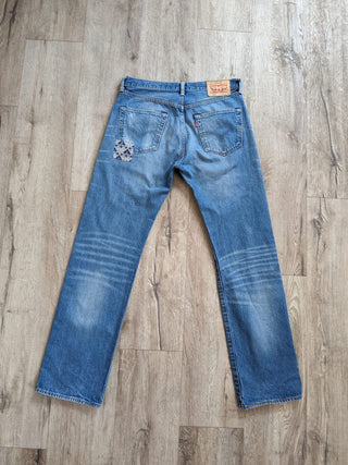 patched upcycled levi jeans on floor