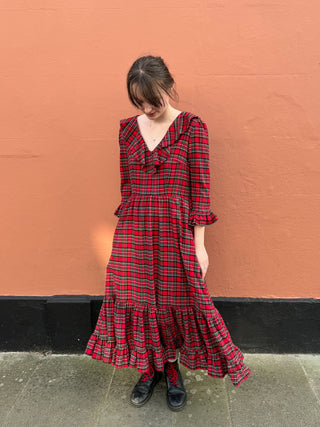 women wearing red tartan dress with full skirt