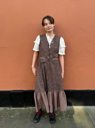 women wearing checked waistcoat with leopard print