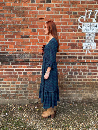 women wearing tartan dress side view
