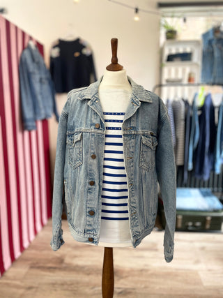 mended denim jacket on mannequin