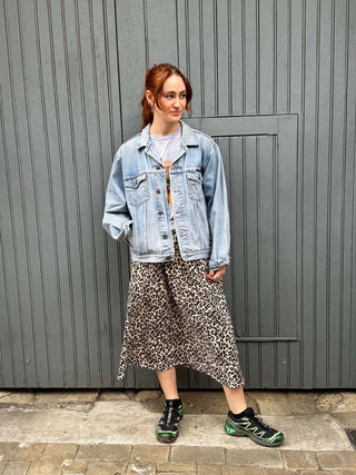 model wearing leopard skirt with denim jacket