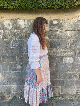 women wearing mixed print skirt side view