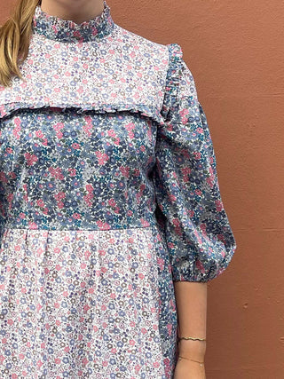 women wearing mixed print floral dress detail
