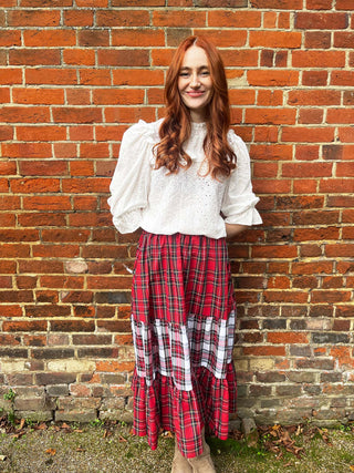 women wearing mixed tartan skirt