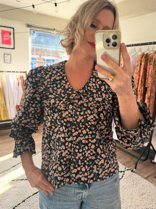 women wearing floral blouse
