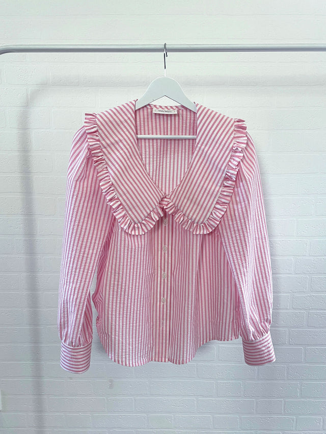The Well Worn pink stripe shirt on rail