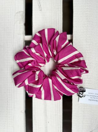 pink stripe scrunchie on wooden table