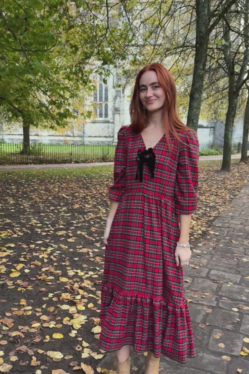 women wearing red check dress
