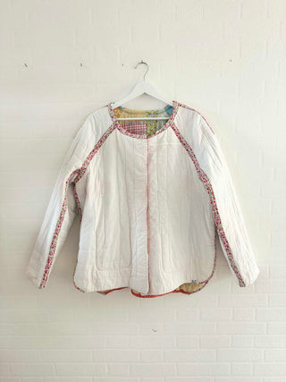 white quilted jacket in studio