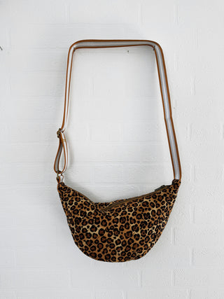 leopard cross body bag on wall