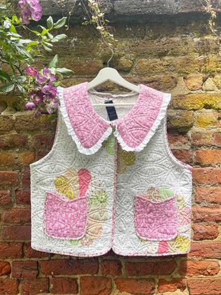 quilted waistcoat hanging on wall