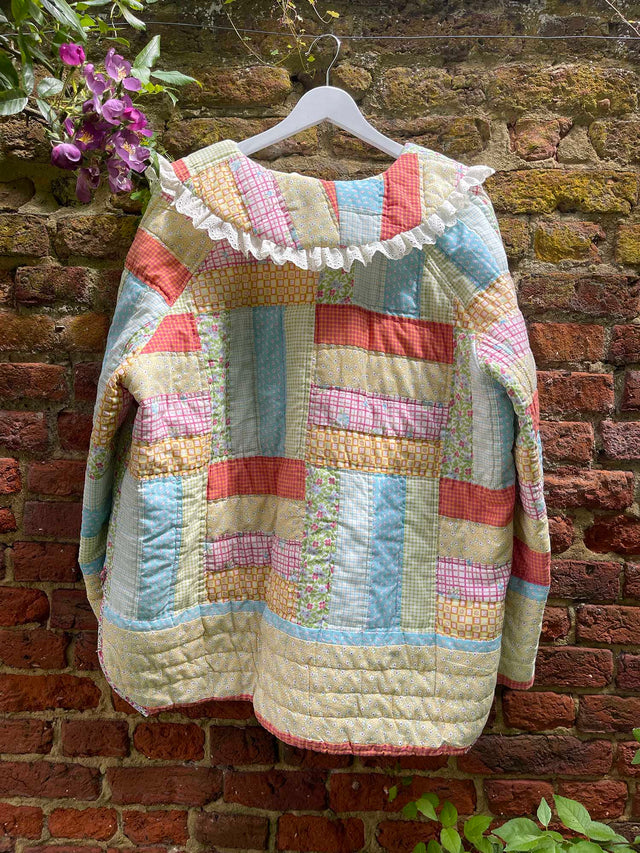 The Well Worn handmade quilted jacket on wall back view