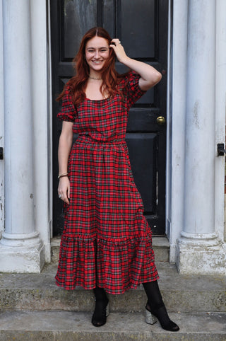 women wearing red check skirt