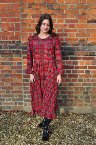 model wearing red check dress