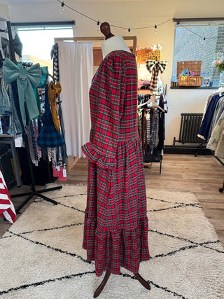 sustainable red tartan dress on mannequin