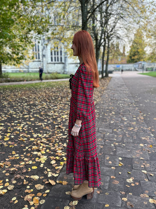 side view women wearing tartan dress 