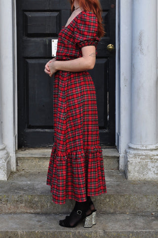 women wearing red check skirt side