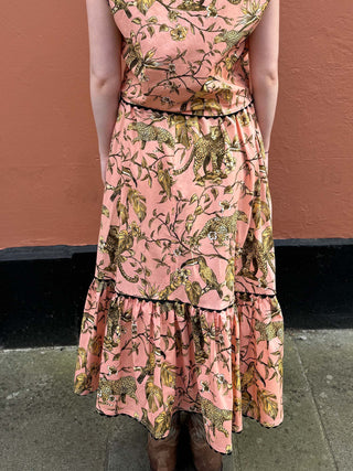 back of women wearing leopard print skirt