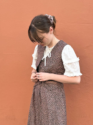 women wearing checked waistcoat with buttons