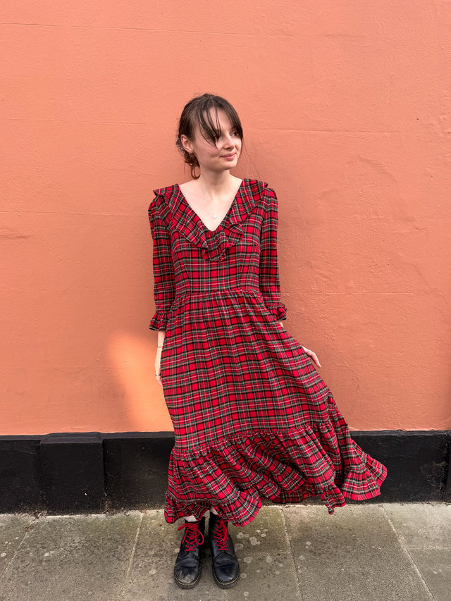 The Well Worn women wearing red tartan dress